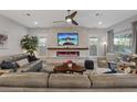 Bright living room featuring a modern fireplace and ample seating at 3018 Fall Solstice Ct, Las Vegas, NV 89138