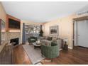 Bright living room boasts a mosaic fireplace, comfortable seating, and a sliding glass door to a private balcony at 3038 Casey Dr # 204, Las Vegas, NV 89120