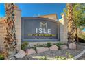 Isle at Monaco community entrance sign with palm trees at 3060 Lapis Beach Dr, Las Vegas, NV 89117