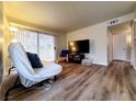 Living room featuring hardwood floors and a flat-screen TV at 3083 Casey Dr # 101, Las Vegas, NV 89120