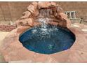 Private spa with a built-in waterfall feature at 3310 Fernbird Ln, North Las Vegas, NV 89084