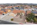 Single-story house with solar panels and a gravel yard at 350 Preston Dr, Henderson, NV 89015