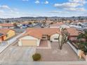 Single-story house with a desert landscape, and a two-car garage at 350 Preston Dr, Henderson, NV 89015