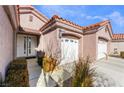 Front view of house with two car garage and walkway at 4182 Bottiglia Ave, Las Vegas, NV 89141