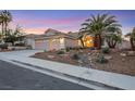 Beautiful curb appeal with landscaping and a three-car garage at 517 Annet St, Henderson, NV 89052