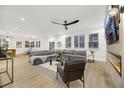 Spacious living room with sectional sofa, fireplace, and large TV at 517 Annet St, Henderson, NV 89052