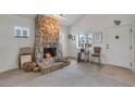 Cozy living room featuring a stone fireplace at 628 L, Boulder City, NV 89005