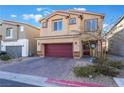 Two-story house with red door and garage at 7141 Liberty Landing St, Las Vegas, NV 89166