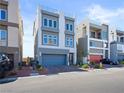 Modern two-story home with gray exterior and attached two-car garage at 7777 Tempest Sol Ave, Las Vegas, NV 89113