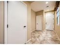 Entryway with tile flooring, white door and closet at 8477 Orly Ave, Las Vegas, NV 89143