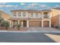 Two-story house with a three-car garage and landscaped yard at 8543 Alpine Vineyards Ct, Las Vegas, NV 89139