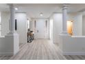 Elegant entryway with light wood floors and a modern console table at 10134 Donald Weese Ct, Las Vegas, NV 89129