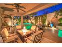 Relaxing covered patio with fire pit and comfortable seating near the pool at 10414 Hemingway Ct, Las Vegas, NV 89149