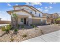 Two-story house with three-car garage and nicely landscaped front yard at 1070 Kelly Brook Ln, Henderson, NV 89011