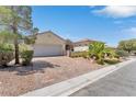 One-story house with a large driveway and mature landscaping at 1717 Warrington Dr, Henderson, NV 89052