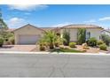 House exterior with palm trees, landscaping, and a paved driveway at 1717 Warrington Dr, Henderson, NV 89052