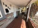 Front porch with tile flooring and covered entryway at 1925 E Saint Louis Ave, Las Vegas, NV 89104