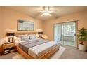 Bright bedroom with king-size bed and private balcony access at 3320 S Fort Apache Rd # 125, Las Vegas, NV 89117