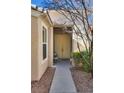 Front entry with double doors, small sitting area, and walkway at 4705 Bersaglio St, Las Vegas, NV 89135