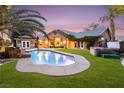 Inviting pool and spa area with lush landscaping at 478 Spanish View Ln, Las Vegas, NV 89110