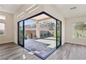 Bright Gathering room with sliding glass doors opening to the backyard at 4973 Sandline Ct, Las Vegas, NV 89135