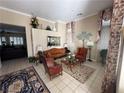 Elegant living room featuring leather furniture, a large mirror, and decorative accents at 5016 Wayfaring Tree Ave, Las Vegas, NV 89131