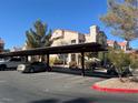 Covered parking structure with designated parking spots for residents at 5225 W Reno Ave # 129, Las Vegas, NV 89118