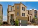 Two-story home with green garage door and light brown and beige exterior at 6075 Wyndham Estate Ave, Las Vegas, NV 89141