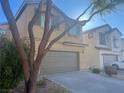 Two-story house with attached garage and landscaping at 6178 Pisan Ln, Las Vegas, NV 89148