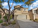 Charming two-story home with a two-car garage, desert landscaping, and neutral-toned stucco in a residential neighborhood at 6178 Pisan Ln, Las Vegas, NV 89148