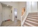 Bright and spacious entryway with staircase and tile flooring at 6403 Ava Ridge Ave, Las Vegas, NV 89141