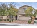 Two-story house with attached garage and mature trees at 6403 Ava Ridge Ave, Las Vegas, NV 89141