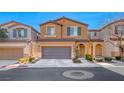 Two story house with a two car garage and landscaped front yard at 7683 Jasmine Falls Dr, Las Vegas, NV 89179