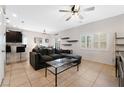 Open living room with sectional sofa and a view of the kitchen at 7879 Narnia Ave, Las Vegas, NV 89113