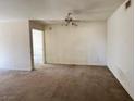 Spacious living room featuring a ceiling fan and natural light at 8070 W Russell Rd # 2068, Las Vegas, NV 89113