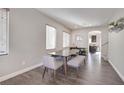 Open dining area, hardwood floors, view to kitchen at 8415 Quarentina Ave, Las Vegas, NV 89149