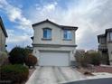 Two-story house with attached garage and landscaping at 9553 Madsen Glen Ct, Las Vegas, NV 89166