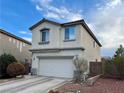 Two-story house with attached garage and landscaping at 9553 Madsen Glen Ct, Las Vegas, NV 89166