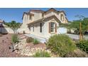 Two-story house with a landscaped front yard and rock features at 2586 Begonia Valley Ave, Henderson, NV 89074