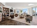 Bright living room featuring hardwood floors, city views, and a stylish sectional sofa at 2857 Paradise Rd # 2203, Las Vegas, NV 89109