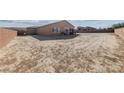 Large, unlandscaped backyard with block wall, providing ample space at 4430 Deliza Ln, Pahrump, NV 89061