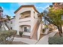 Two-story condo building with walkway and landscaping at 5655 E Sahara Ave # 2064, Las Vegas, NV 89142