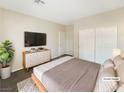 Bright bedroom with large bed, dresser, and closet at 6162 Denton Ranch Rd, Las Vegas, NV 89131