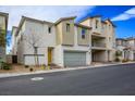Contemporary two-story home with a two-car garage and neat landscaping at 6935 Magenta Moon St, North Las Vegas, NV 89086