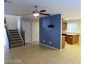 Spacious living room with tile floors and a view of the kitchen at 8058 Torremolinos Ave, Las Vegas, NV 89178