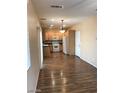 Open concept kitchen with white appliances and wood cabinets at 8708 Gateway Glen Dr, Las Vegas, NV 89178