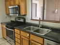 Kitchen features stainless steel appliances and dark countertops at 10321 Junction Hill Dr, Las Vegas, NV 89134
