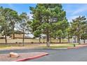Community park with mature trees, green space and seating at 1900 N Torrey Pines Dr # 112, Las Vegas, NV 89108