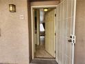 Condo entryway with security door and interior view at 2060 Mesquite Ln # 104, Laughlin, NV 89029