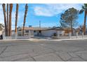 Single story home with landscaped yard and driveway at 2116 Fuller Rd, Las Vegas, NV 89108